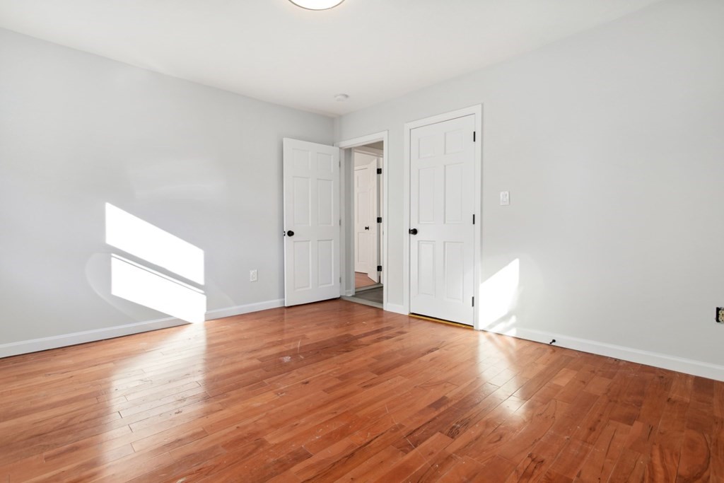 28 Warren Street Peabody, MA 01960 - Photo 24 of 37 a view of an empty room with wooden floor