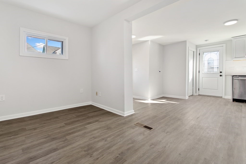 28 Warren Street Peabody, MA 01960 - Photo 5 of 37 a view of a room with wooden floor and a window