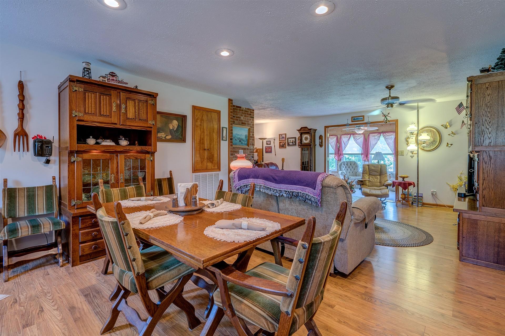 5756 White House Road Moneta, VA 24121 - Photo 12 of 35 a view of a dining room with furniture and wooden floor