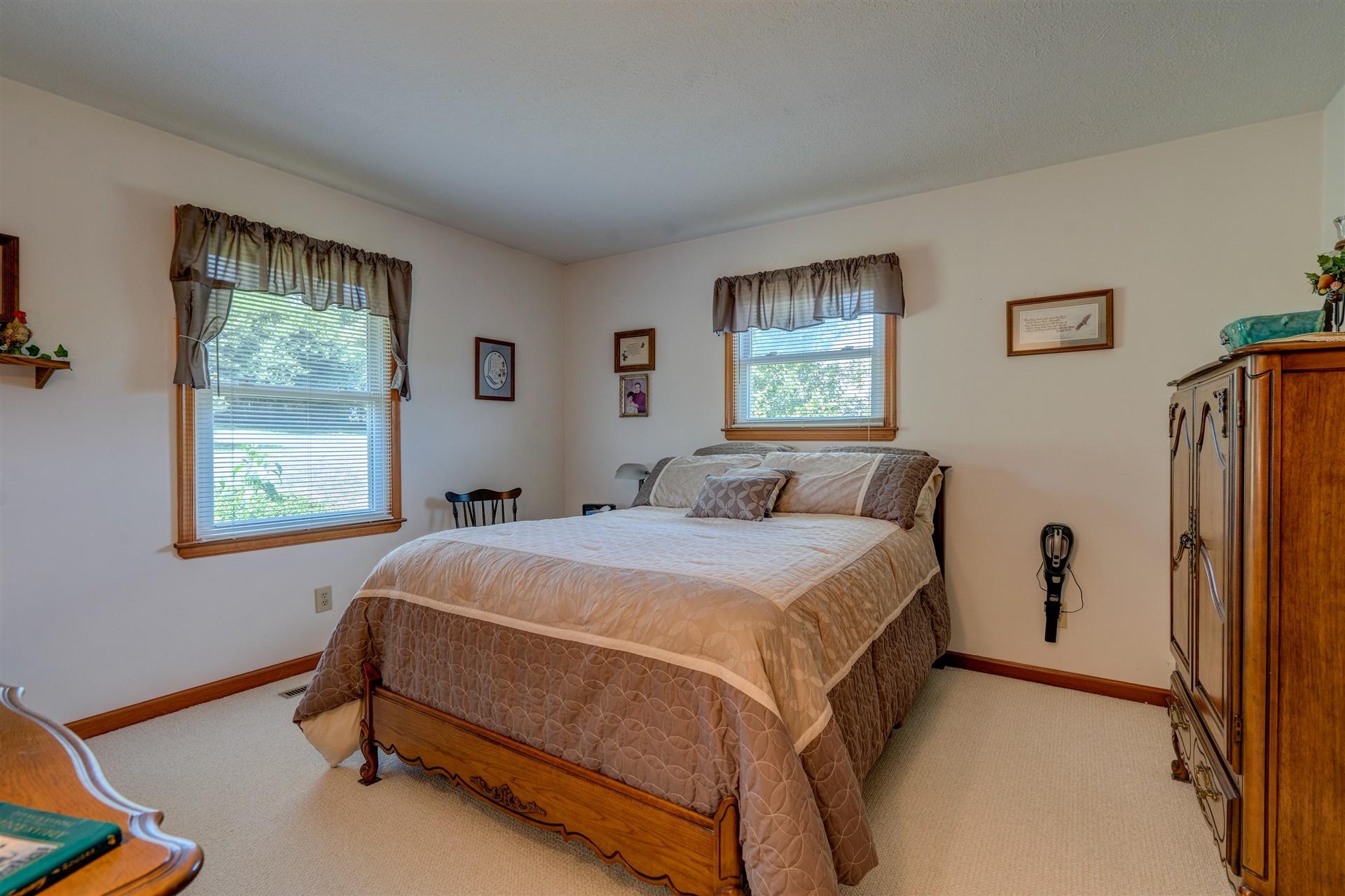 5756 White House Road Moneta, VA 24121 - Photo 18 of 35 a bedroom with a bed and a window