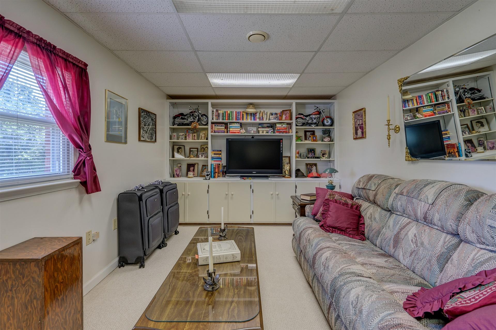 5756 White House Road Moneta, VA 24121 - Photo 25 of 35 a living room with furniture and a flat screen tv