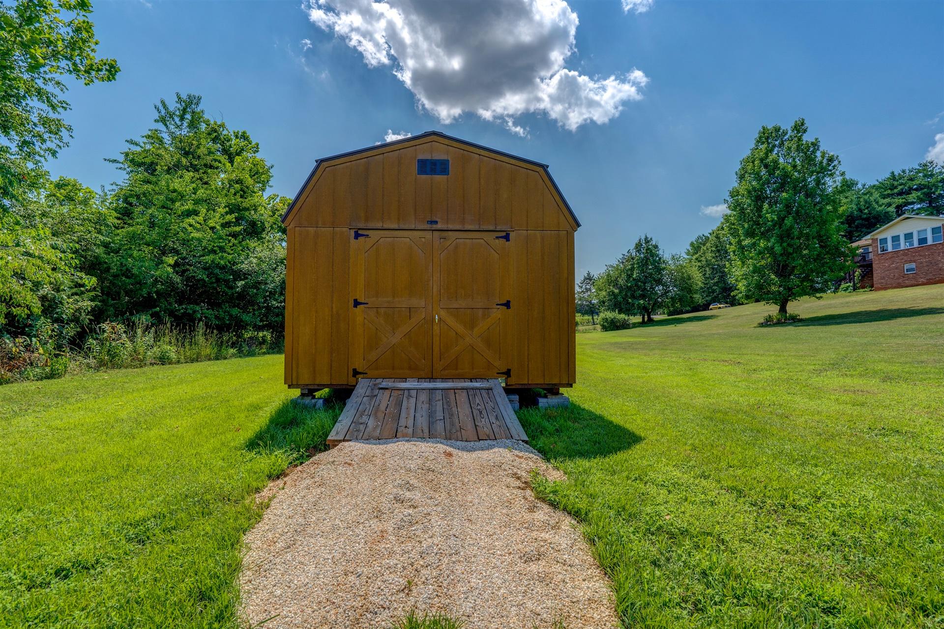 5756 White House Road Moneta, VA 24121 - Photo 29 of 35 a view of a garden area with large trees