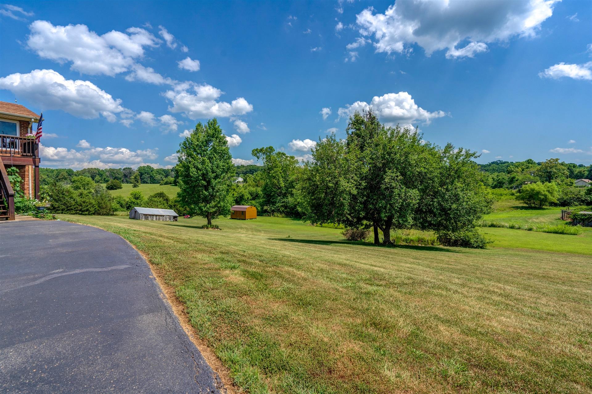 5756 White House Road Moneta, VA 24121 - Photo 31 of 35 a view of a garden with a building in the background