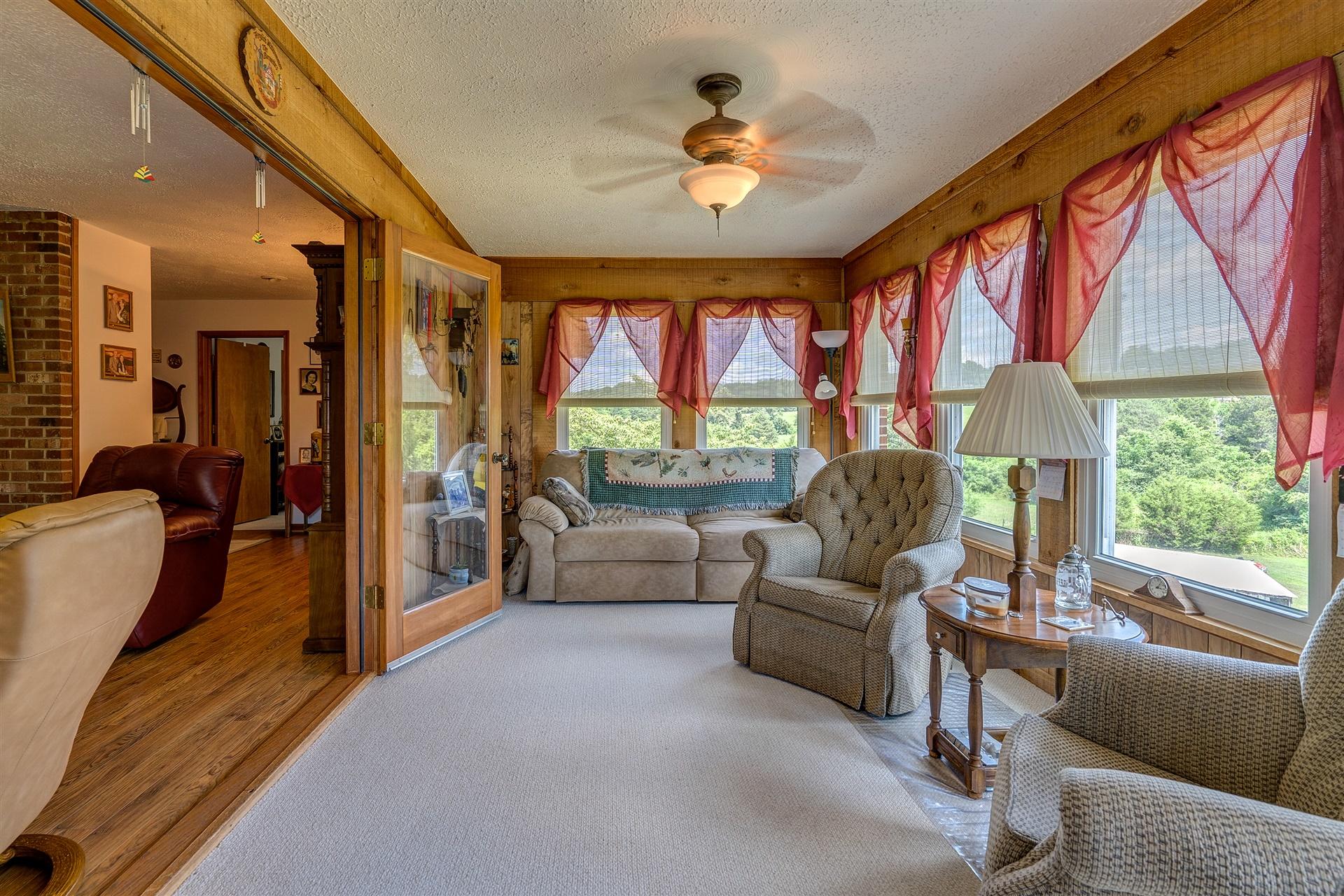 5756 White House Road Moneta, VA 24121 - Photo 6 of 35 a living room with furniture and a large window