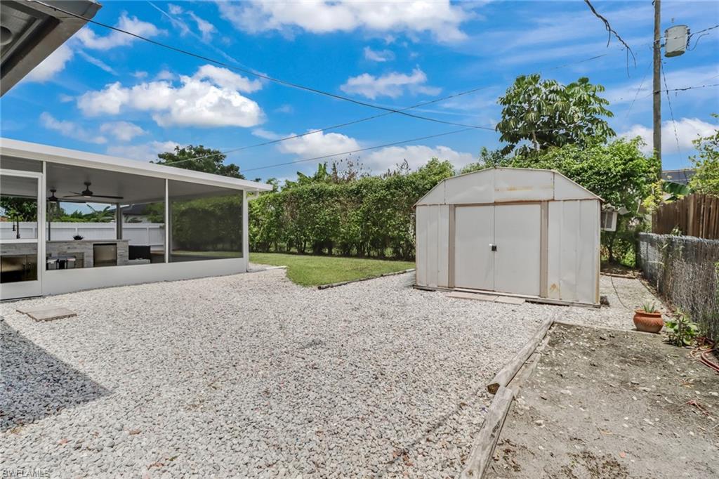 5131 31st Place Southwest Naples, FL 34116 - Photo 24 of 24 a view of a house with a yard and garage
