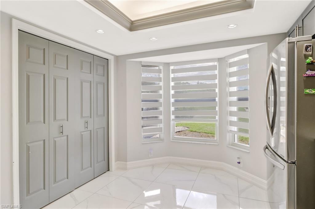 5131 31st Place Southwest Naples, FL 34116 - Photo 7 of 24 a view of an empty room with a window