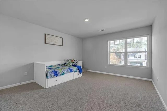 an empty room with toys and a window