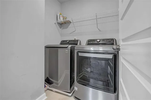 a utility room with dryer and washer
