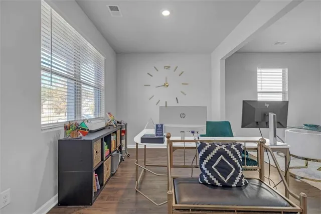 a dining room with furniture and window