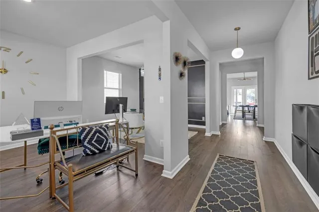 a view of a livingroom with furniture and wooden floor