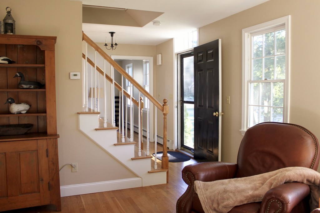 8 Brookside Lane Sterling, MA 01564 - Photo 13 of 26 a living room with furniture and stairs