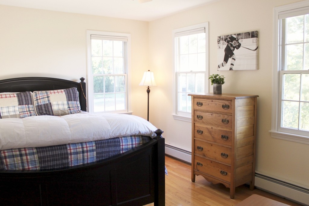 8 Brookside Lane Sterling, MA 01564 - Photo 16 of 26 a bedroom with a bed and a window