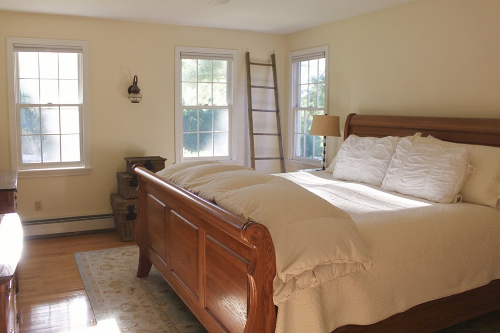 8 Brookside Lane Sterling, MA 01564 - Photo 18 of 26 a bedroom with a bed and a window