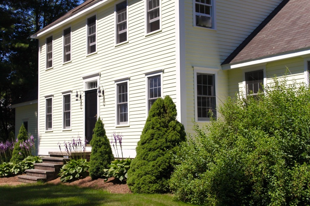 8 Brookside Lane Sterling, MA 01564 - Photo 2 of 26 a front view of a house with a yard