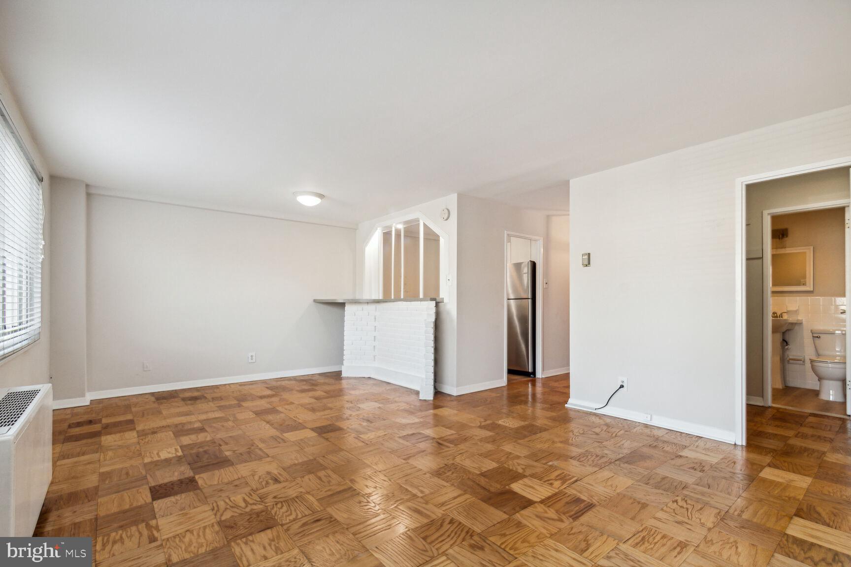 1900 Lyttonsville Road, Unit 403 Silver Spring, MD 20910 - Photo 3 of 18 Living/Dining Area