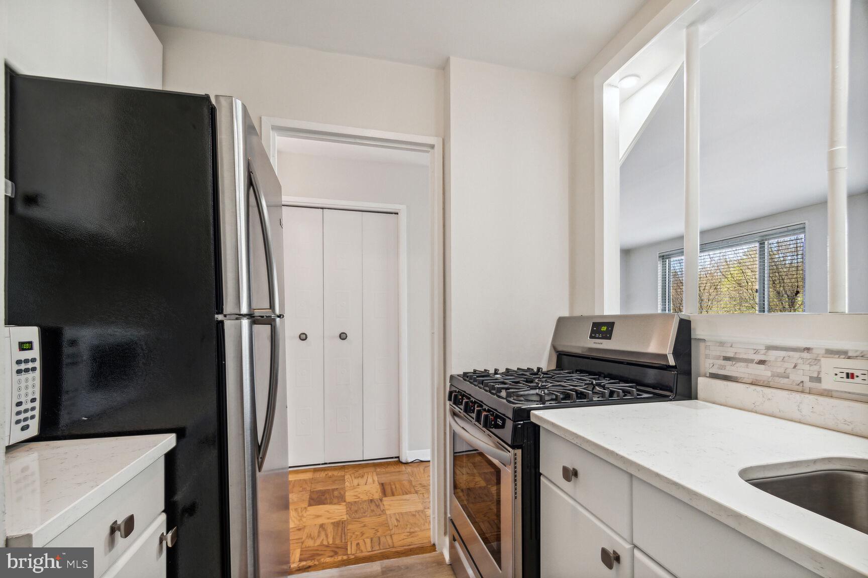 1900 Lyttonsville Road, Unit 403 Silver Spring, MD 20910 - Photo 5 of 18 Updated Kitchen