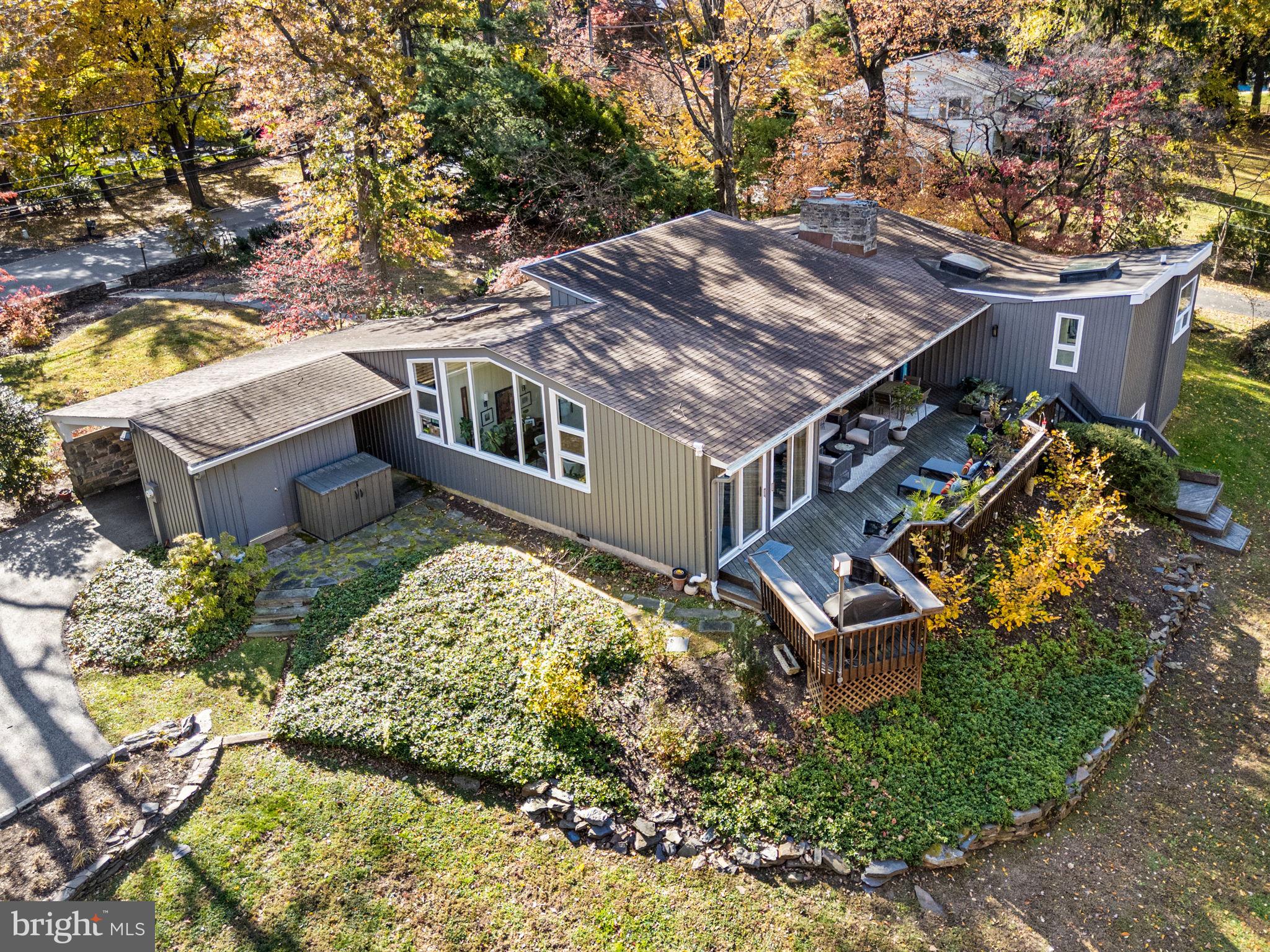 1424 Flat Rock Road Penn Valley, PA 19072 - Photo 2 of 33 an aerial view of a house with a yard and trees