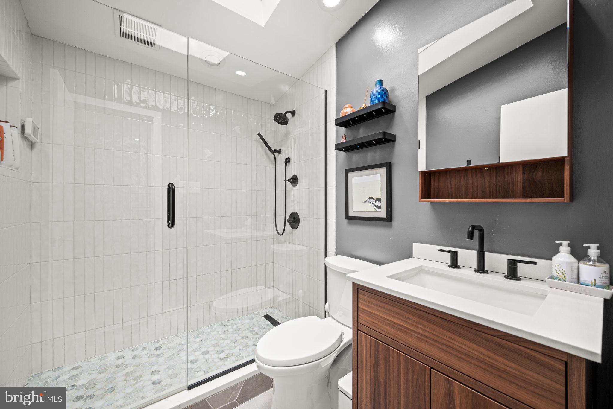1424 Flat Rock Road Penn Valley, PA 19072 - Photo 24 of 33 a bathroom with a sink toilet and shower