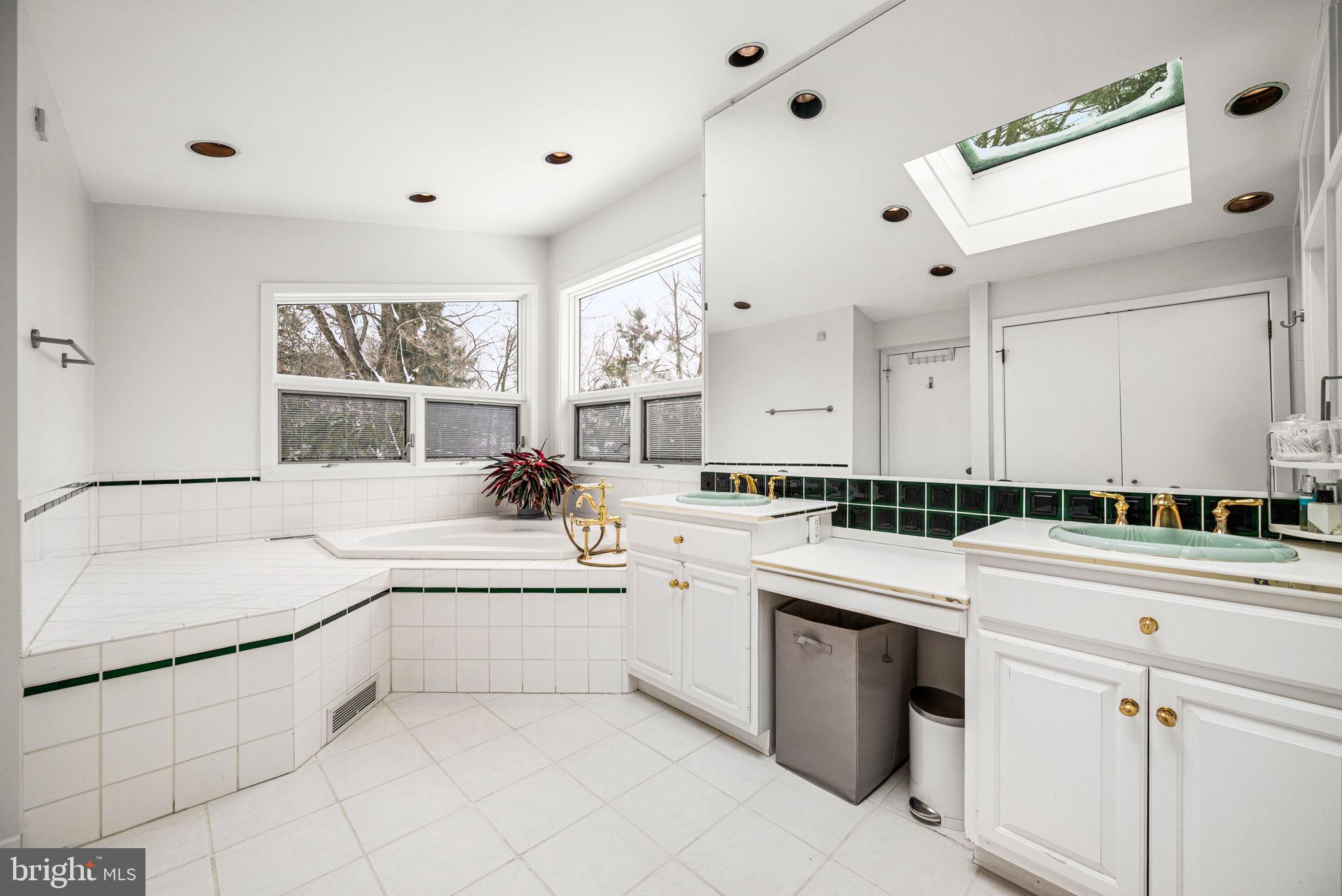1424 Flat Rock Road Penn Valley, PA 19072 - Photo 27 of 33 a large white kitchen with a sink and cabinets