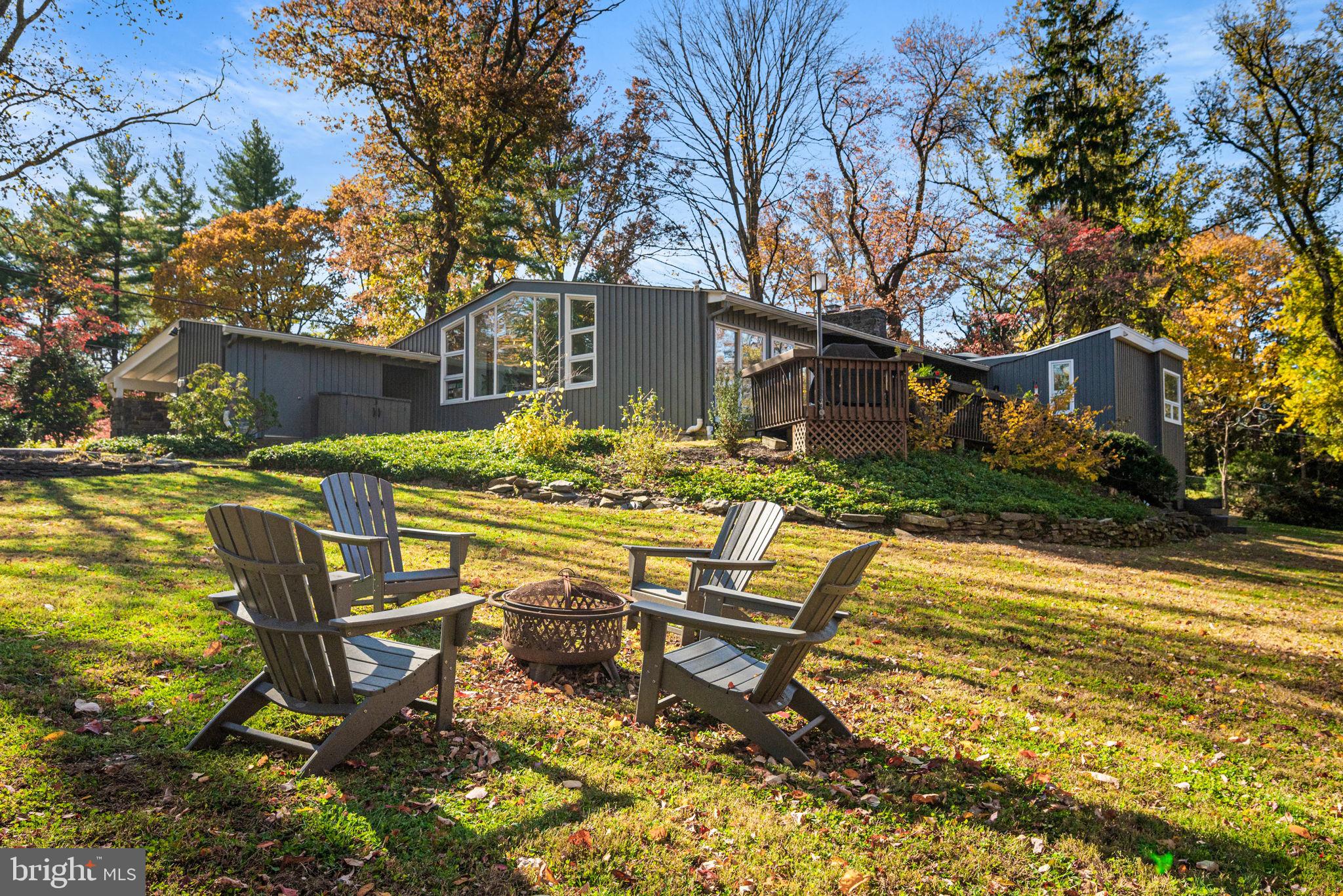 1424 Flat Rock Road Penn Valley, PA 19072 - Photo 4 of 33 a view of a house with backyard sitting area and garden
