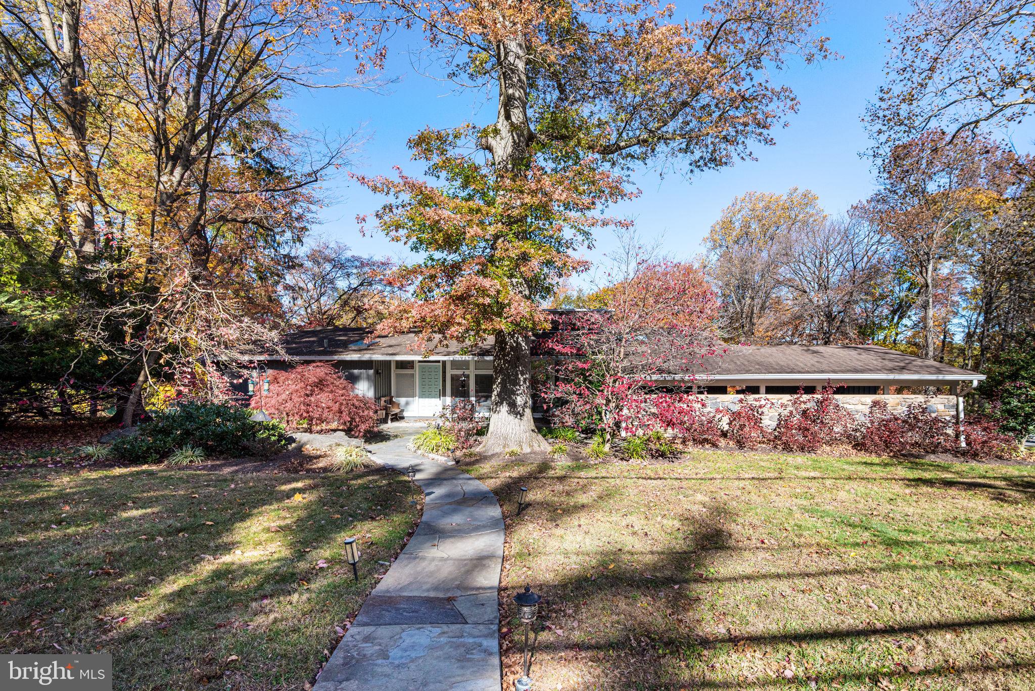 1424 Flat Rock Road Penn Valley, PA 19072 - Photo 5 of 33 a front view of a house with a yard