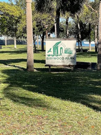 a view of swimming pool with a garden and trees