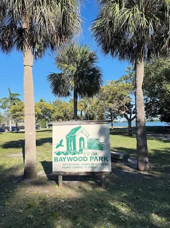 a view of swimming pool with a garden and trees