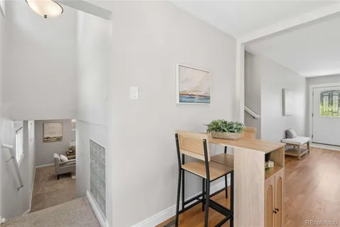 a workspace room with furniture and wooden floor