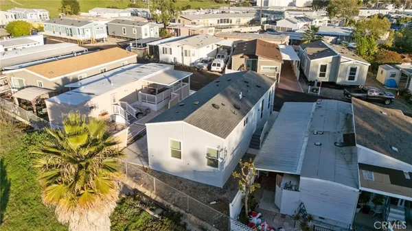 an aerial view of residential houses with outdoor space