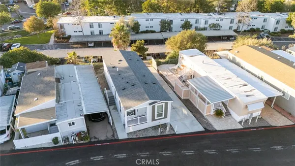 a aerial view of a house with a yard
