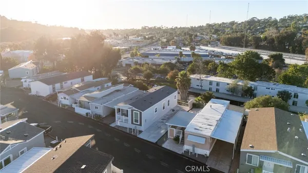 an aerial view of residential houses with outdoor space