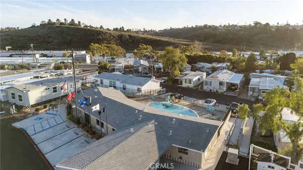 an aerial view of residential houses with outdoor space
