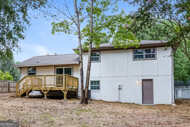a view of a house with a yard and garage