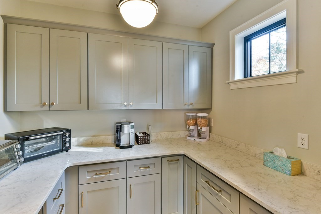 15 Lakeview Road Webster, MA 01570 - Photo 13 of 42 a kitchen with a sink cabinets and window