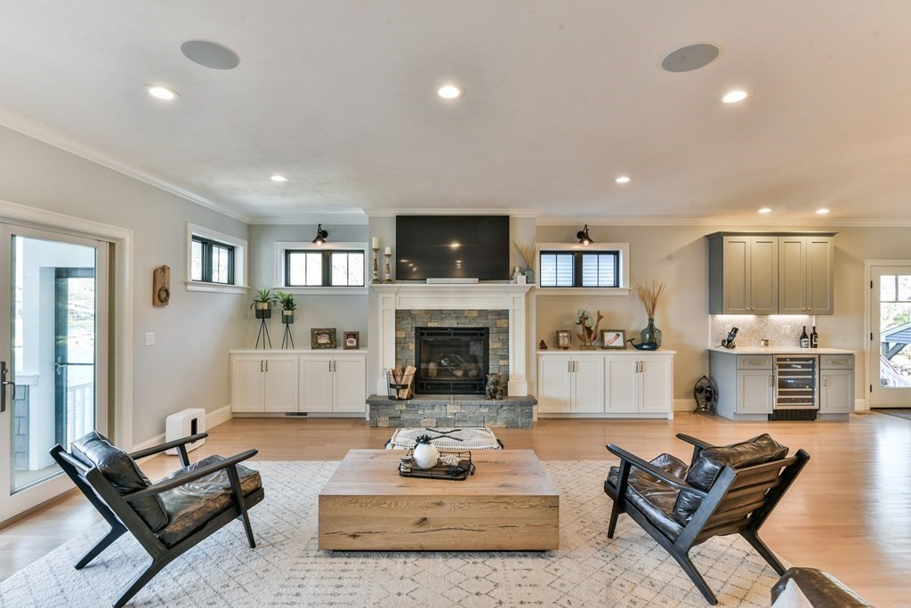 15 Lakeview Road Webster, MA 01570 - Photo 14 of 42 a living room with furniture a flat screen tv and a fireplace
