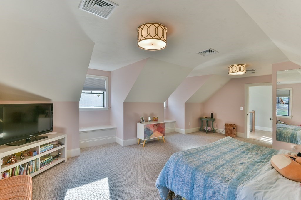 15 Lakeview Road Webster, MA 01570 - Photo 20 of 42 a bedroom with a bed and a flat screen tv
