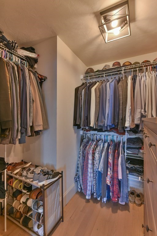 15 Lakeview Road Webster, MA 01570 - Photo 28 of 42 a view of walk in closet with clothes and shoes