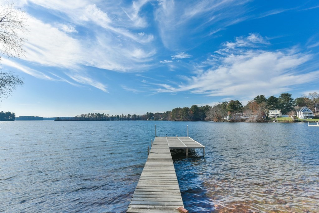 15 Lakeview Road Webster, MA 01570 - Photo 3 of 42 a wooden pier with boats in a lake