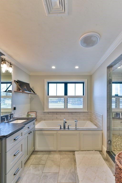 15 Lakeview Road Webster, MA 01570 - Photo 32 of 42 a spacious bathroom with a tub double sink window and mirror