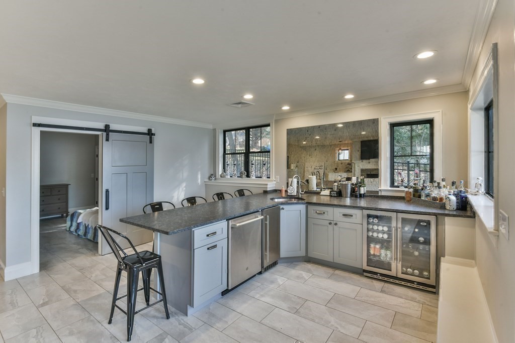 15 Lakeview Road Webster, MA 01570 - Photo 35 of 42 a kitchen with a sink and chairs