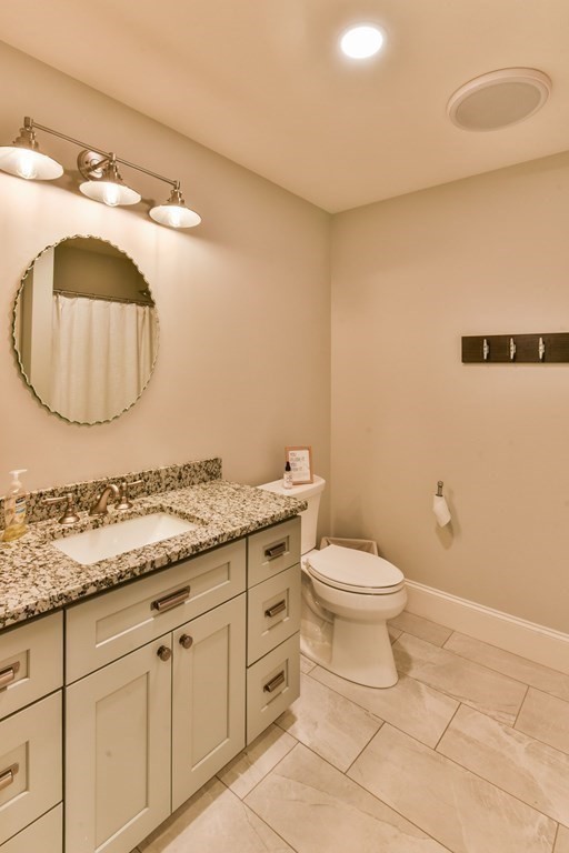 15 Lakeview Road Webster, MA 01570 - Photo 39 of 42 a bathroom with a toilet a sink and mirror