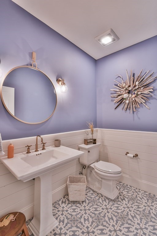 15 Lakeview Road Webster, MA 01570 - Photo 5 of 42 a bathroom with a sink a toilet and mirror