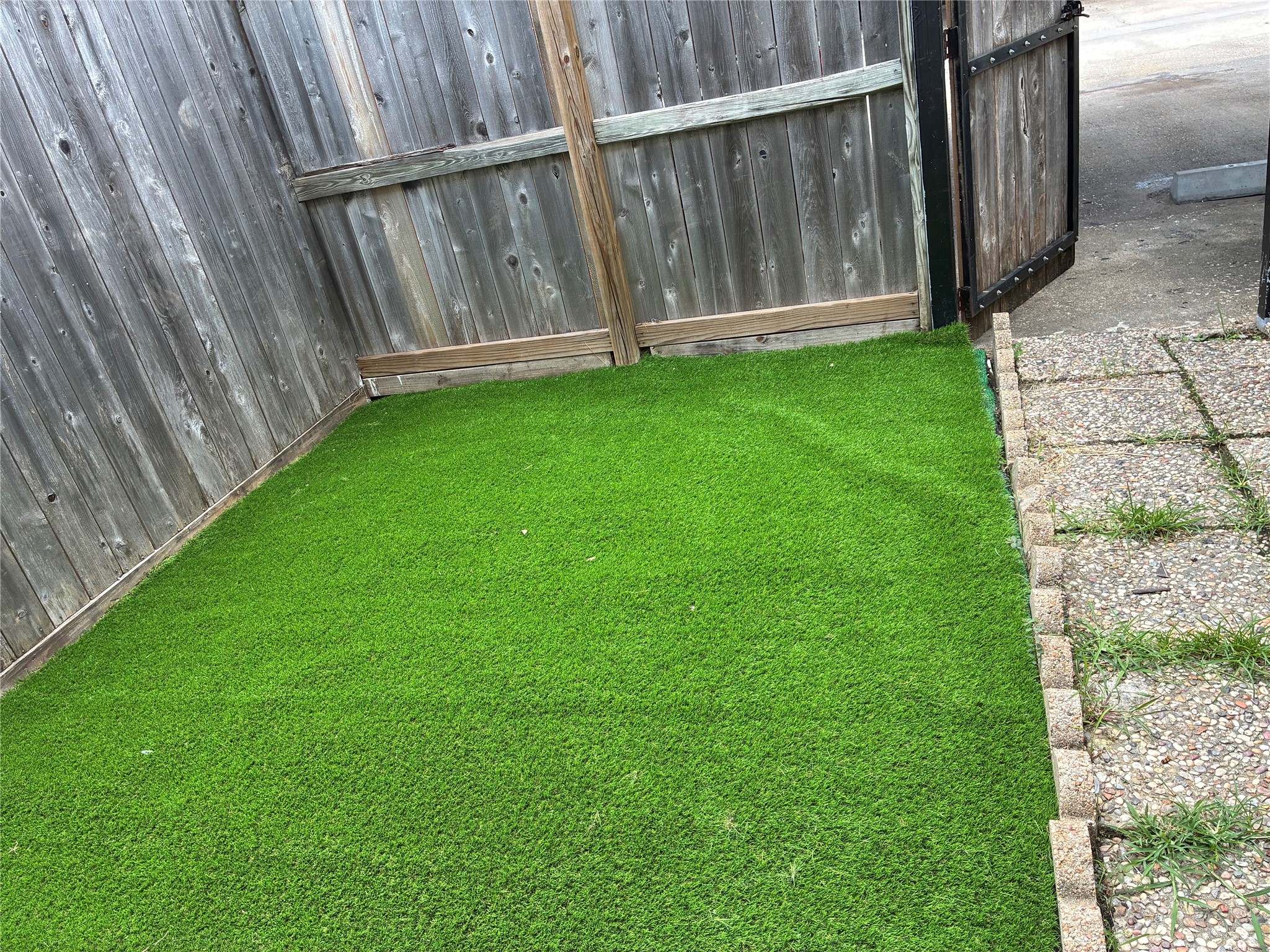 6401 Deihl Road, Unit 202 Houston, TX 77092 - Photo 23 of 24 Astro turf in the carport patio