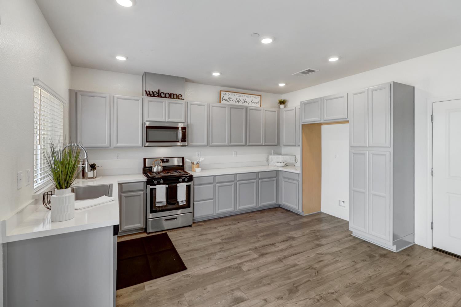 2887 Krone Way Antelope, CA 95843 - Photo 5 of 46 a kitchen with a refrigerator and a sink
