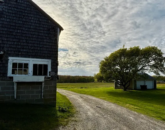 a view of a house with a big yard