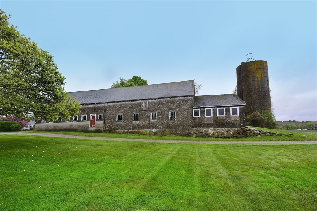 482 Smith Neck Road Dartmouth, MA 02748 - Photo 21 of 40 a front view of house with yard and green space