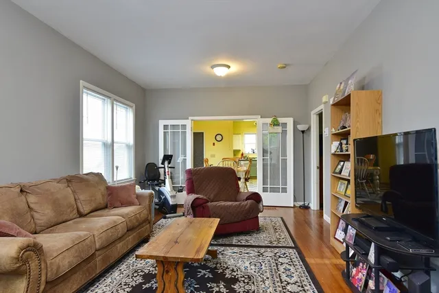 a view of a bedroom with a door and windows