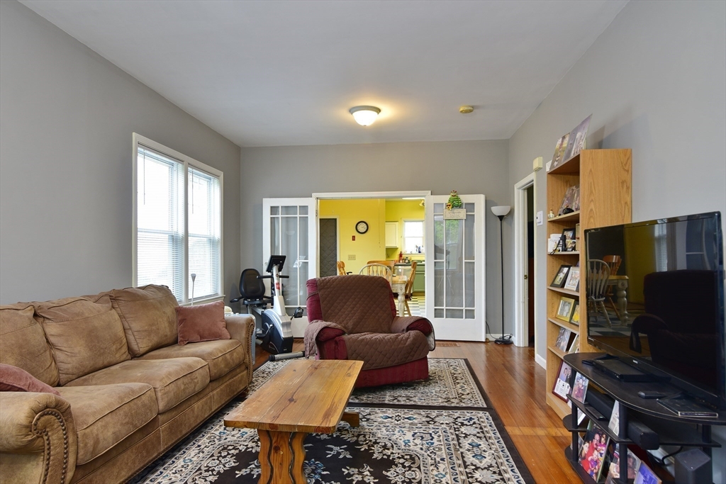 482 Smith Neck Road Dartmouth, MA 02748 - Photo 28 of 40 a living room with furniture a flat screen tv and a window