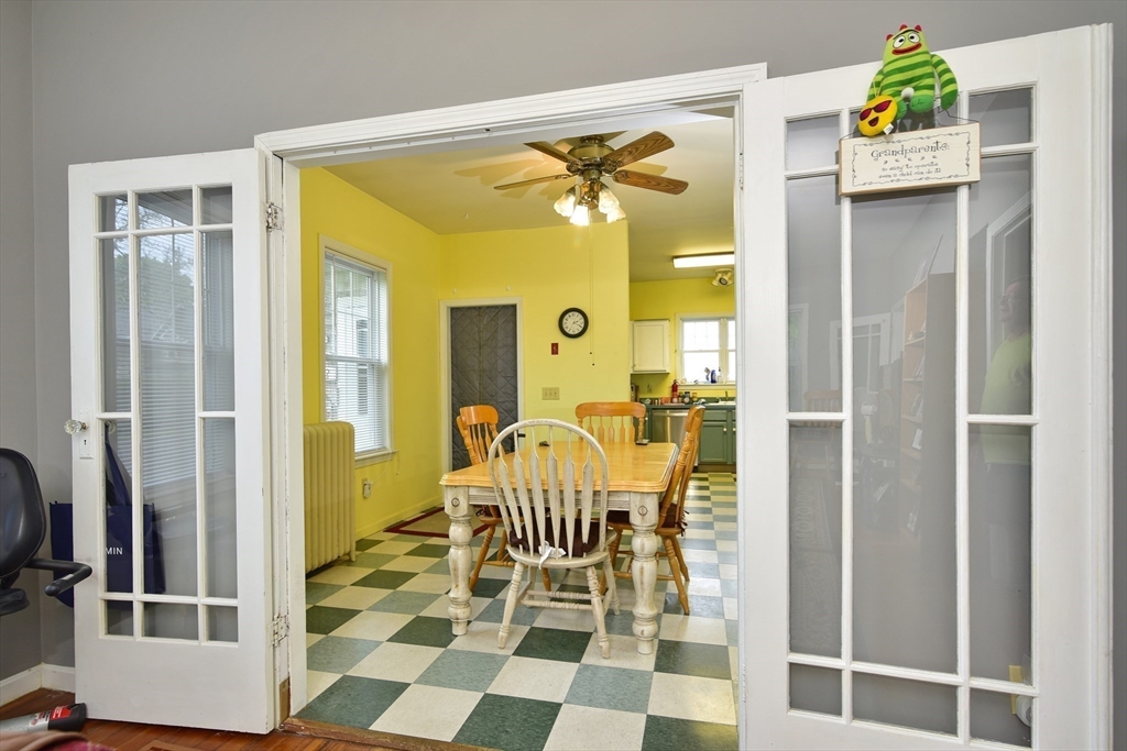 482 Smith Neck Road Dartmouth, MA 02748 - Photo 29 of 40 a view of a bedroom with a door and windows