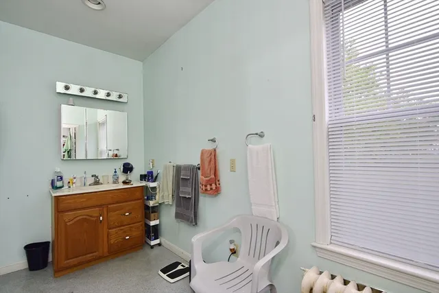 a view of a room with furniture and book shelf